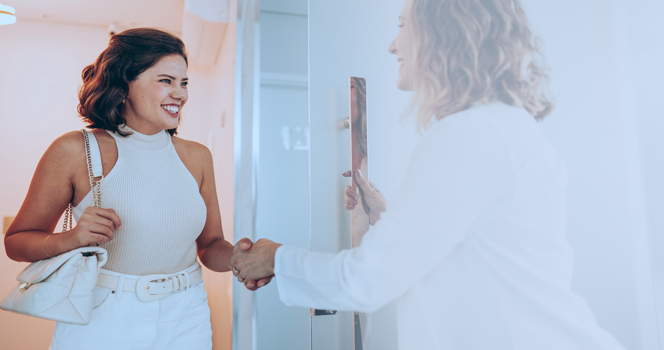 Woman smiling while talking to medical staff in clinic