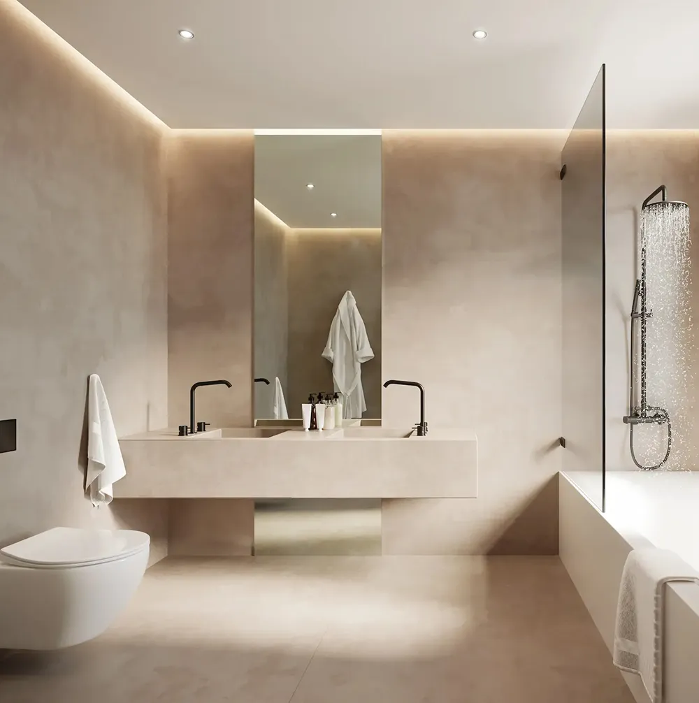 Moderne beige badeværelse med væghængt toilet, stor rektangulær vask, spejl og bruseniche.