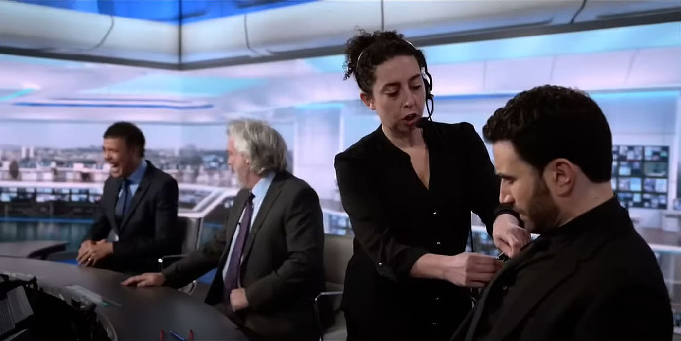 A scene from Ted Lasso in which Roy Kent appears as a reluctant pundit on Sky Sports Soccer Saturday. The set design features the dgital backdrop created y Jim Mann at Lightwell
