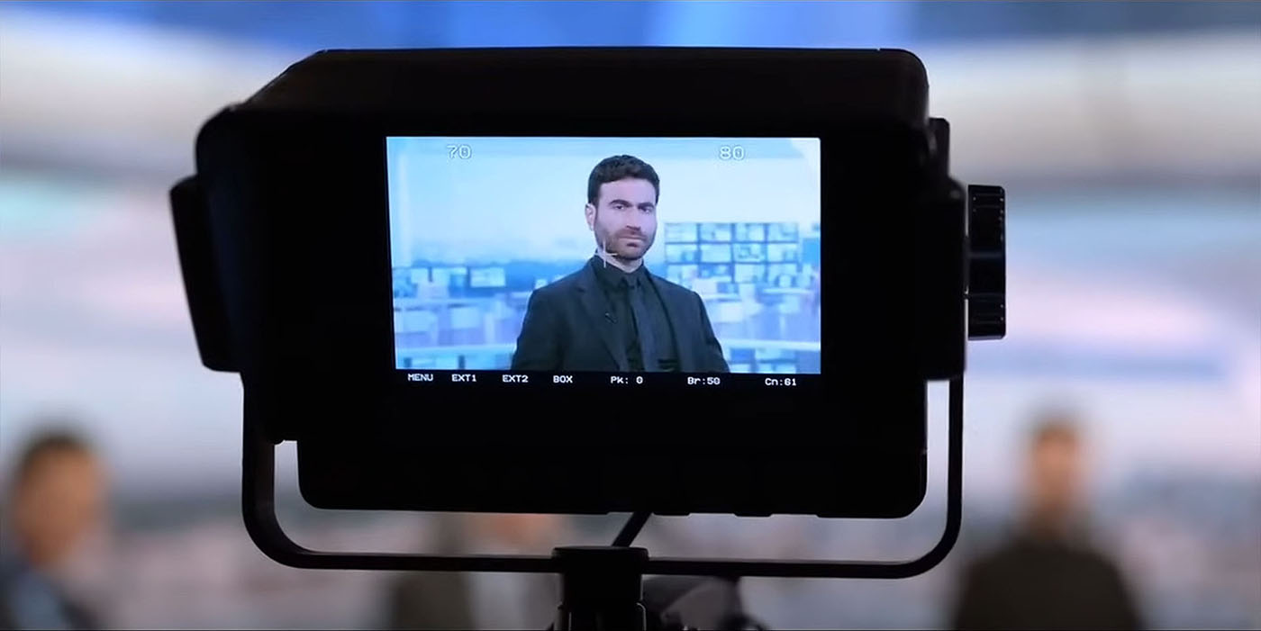 A scene from Ted Lasso in which Roy Kent appears as a reluctant pundit on Sky Sports Soccer Saturday. The set design features the dgital backdrop created y Jim Mann at Lightwell