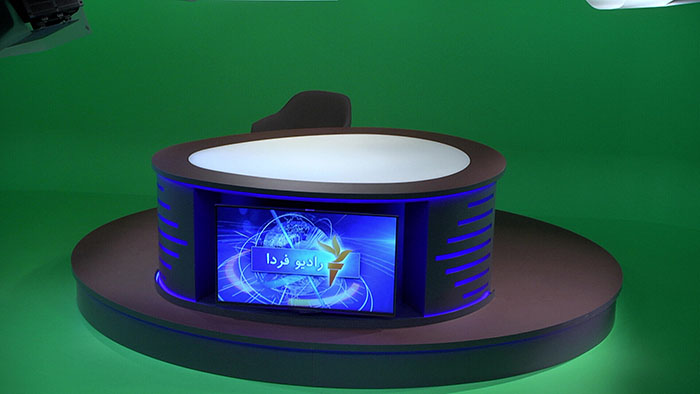 The desk sat within the greenscreen