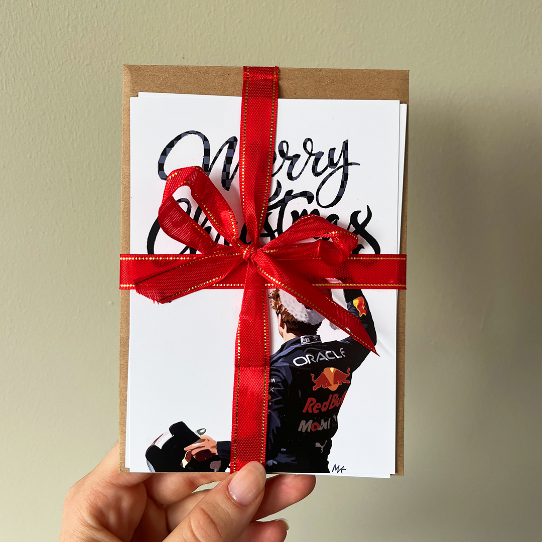 Set of 2 Max Verstappen Christmas Cards A set of two Christmas cards featuring Max Verstappen.