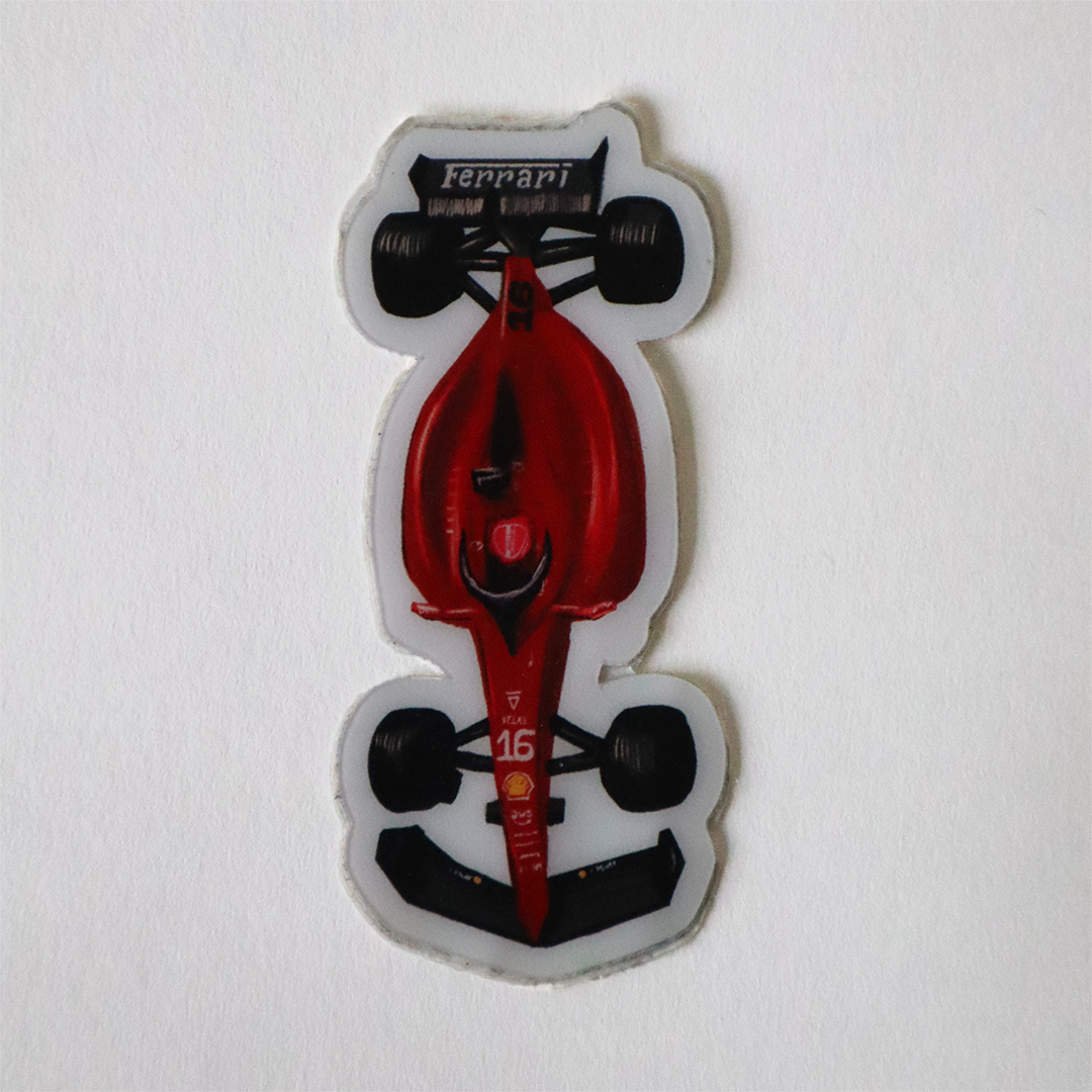 A fun cartoon-style sticker of a Ferrari car with a white outline and a matte finish.