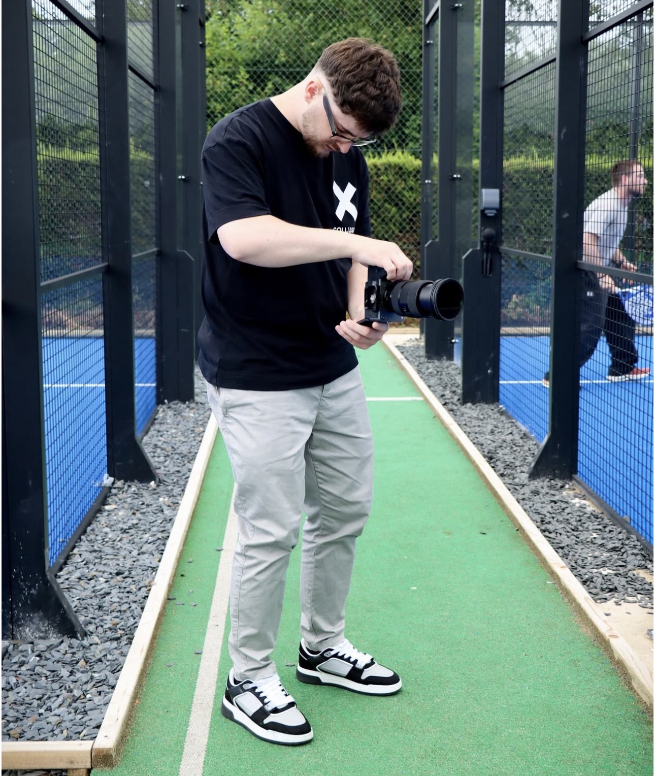 photo of a member of the team holding camera a content shoot 