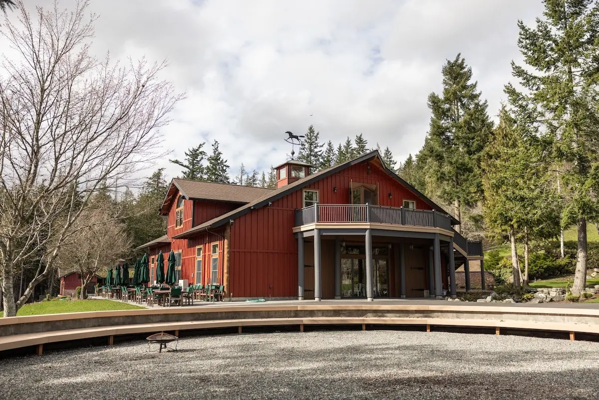 Driveway leading through a forest into Scimitar Ridge Ranch, a retreat rental venue in Anacortes, WA. 