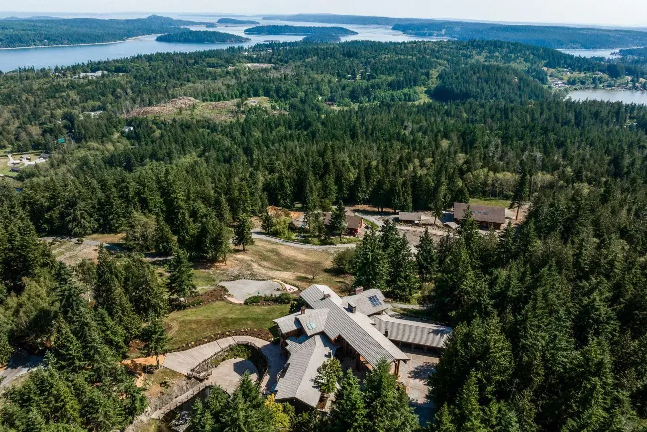 An aerial view of Scimitar Ridge Ranch, with the luxury lodge, Ark building, Yellowstone Center visible.