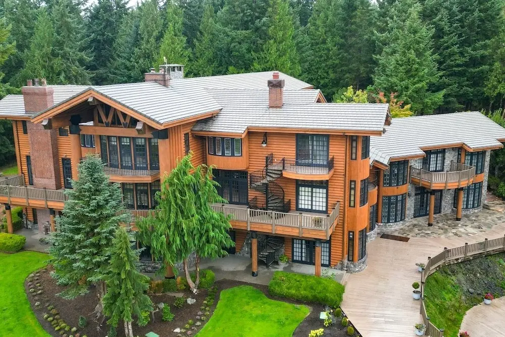 The three story, 22,000 sq ft Luxury Lodge vacation rental at Scimitar sits on top of a hill in Anacortes, WA.