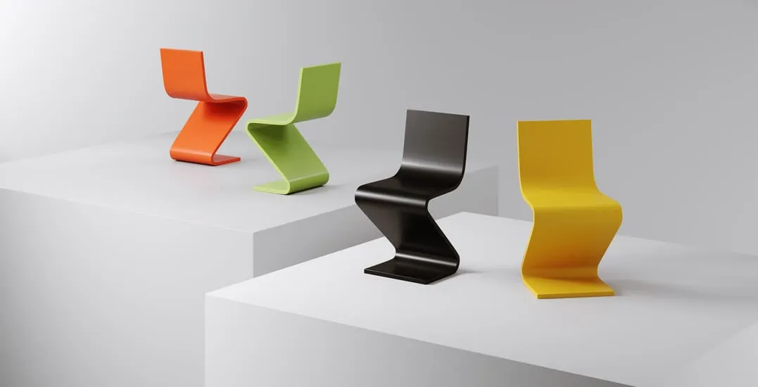 Four vibrant, modern chairs in orange, green, black, and yellow, displayed on white pedestals. This emphasizes the benefits of 3D product visualization in showcasing product variations and design details in a clear and engaging manner.