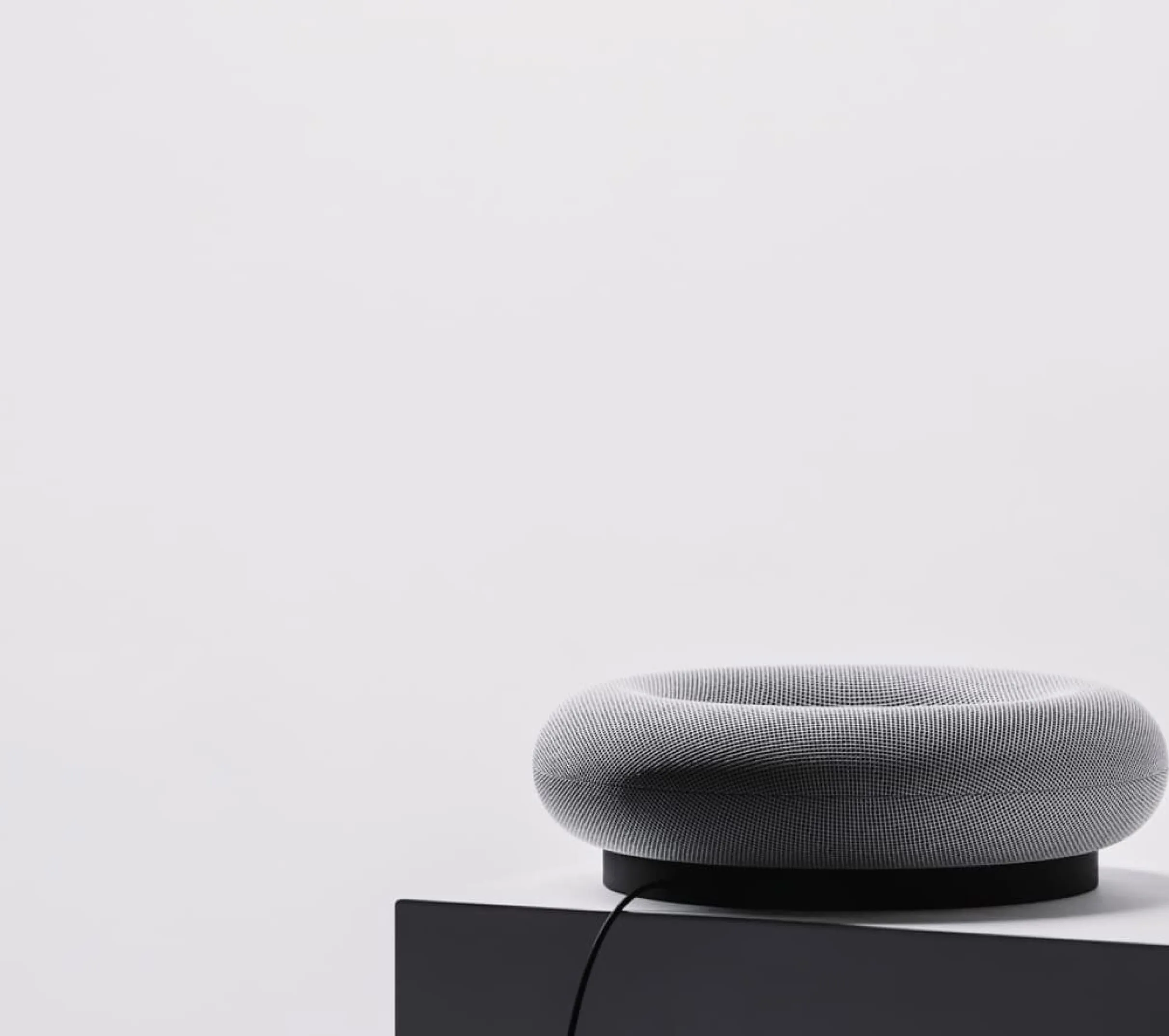 A full shot of the donut-shaped speaker rendered in a minimalist scene — final product visualization by Product 3D Modeling Services.