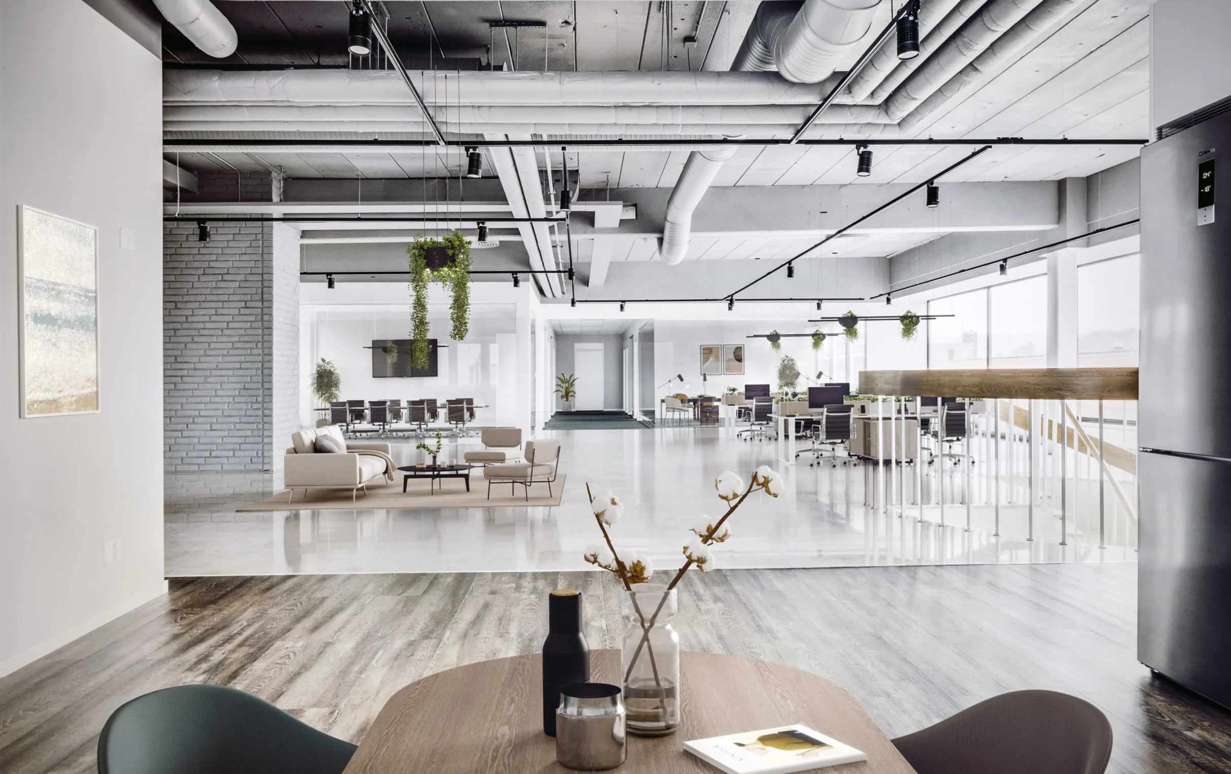 Spacious modern office interior enhanced with digital staging, featuring a blend of collaborative workspaces, a conference area, lounge seating, and hanging greenery under an industrial-style ceiling.
