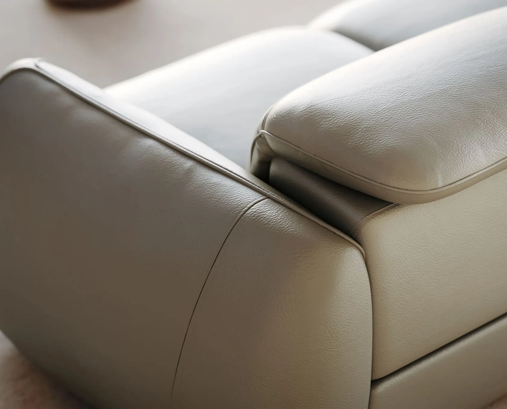 Close-up 3D rendering of modern wall sconces, designed with concentric metallic rings that radiate light, mounted on a textured blue wall.