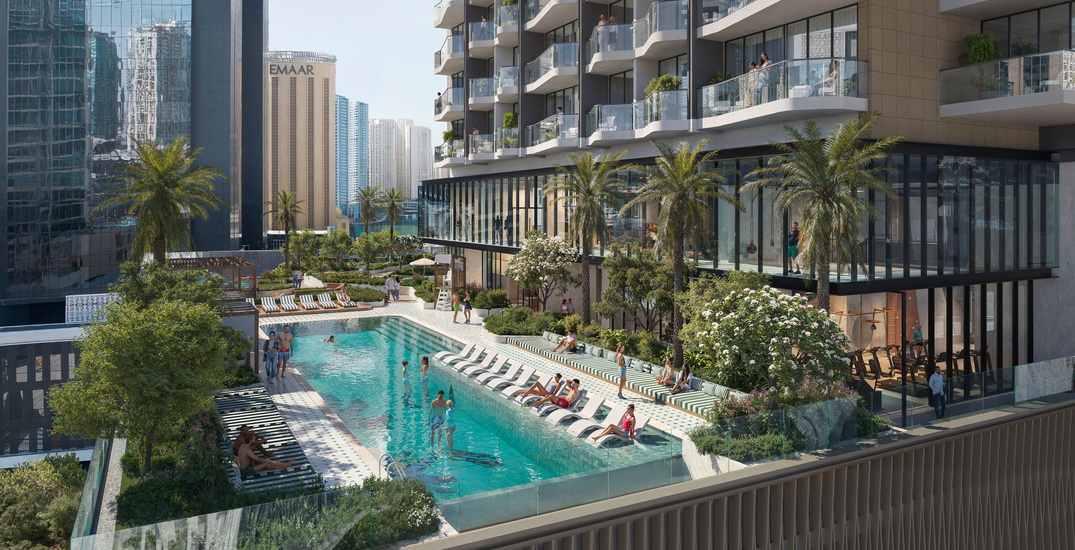 Rooftop pool area of a high-rise residential tower with landscaped lounging spaces and views of a city skyline – premium amenity highlight in a construction project portfolio.