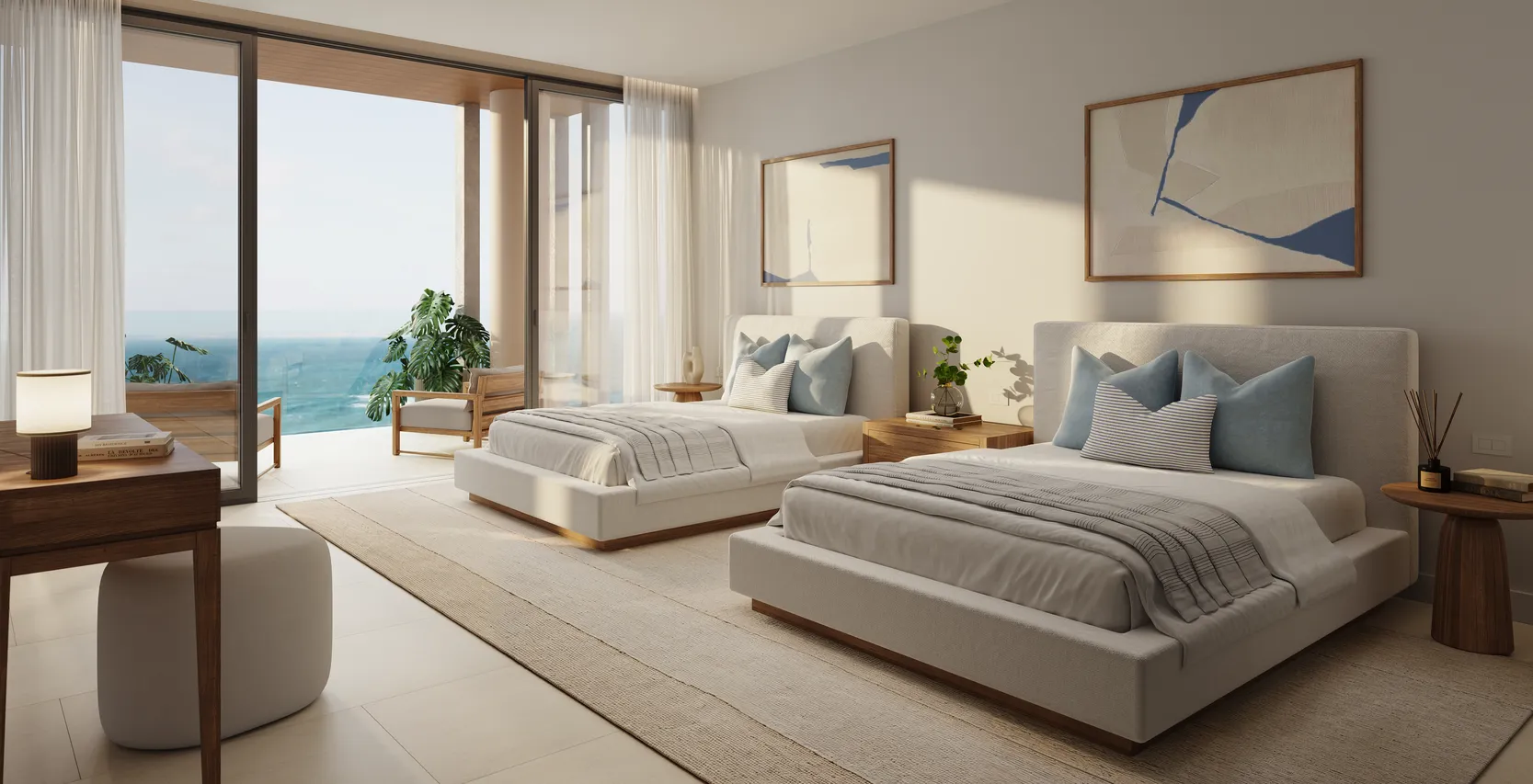 Light and airy staging a bedroom design featuring two upholstered beds, coastal-inspired artwork, natural wood furniture, and an ocean-view balcony.