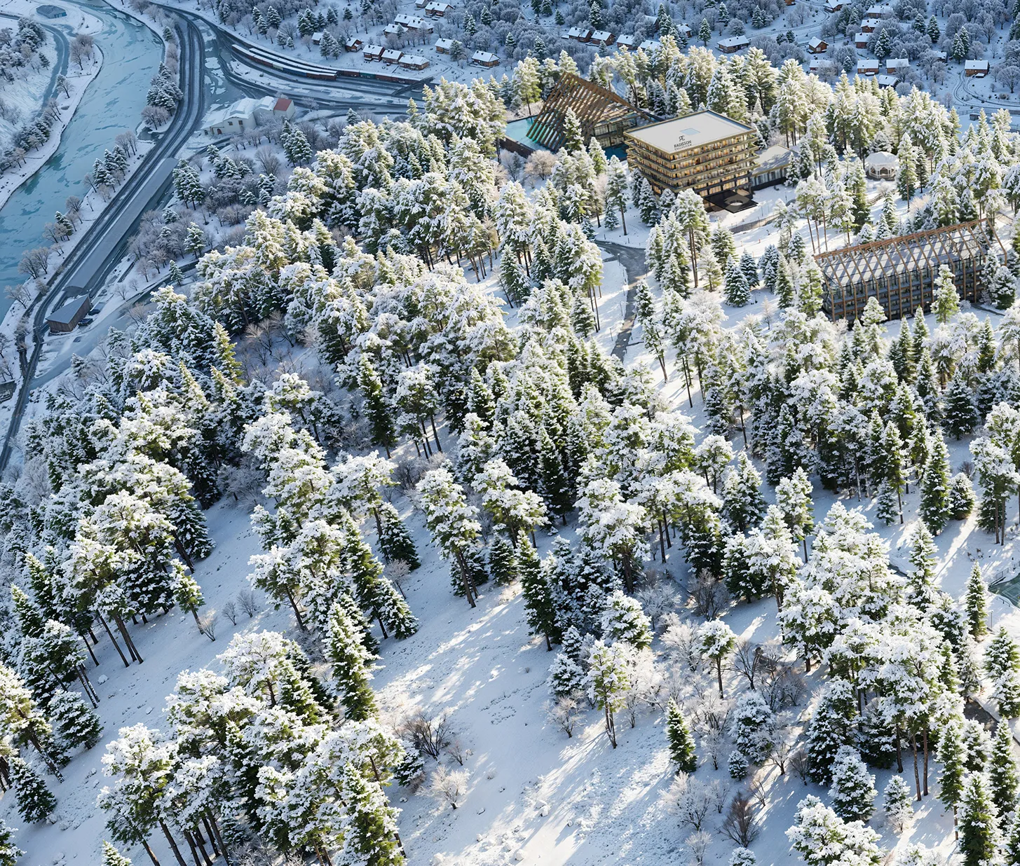 People walking along exterior stairs of a rust-colored architectural structure in the mountains, presented with 3D exterior rendering services.