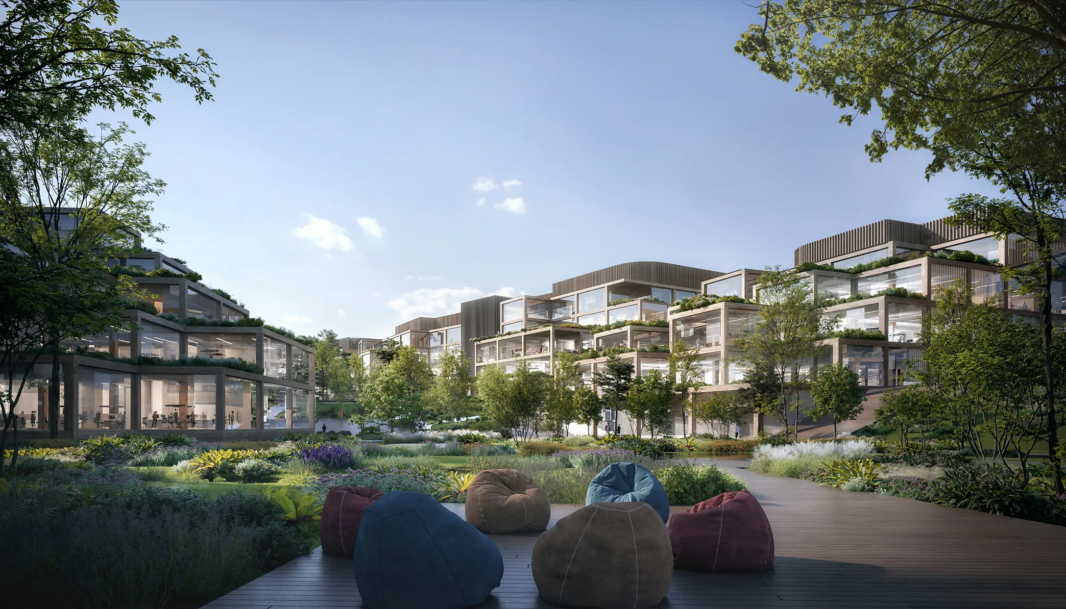 Eco-friendly urban complex with green rooftops and solar panels surrounded by mountains, visualized with 3D exterior rendering services.