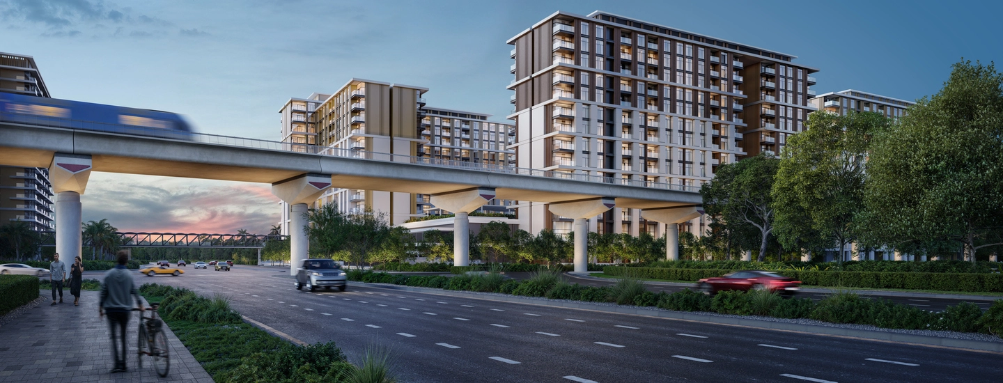Modern apartment buildings near elevated transit and landscaped streets, demonstrating smart urban planning strategies for building a real estate portfolio.