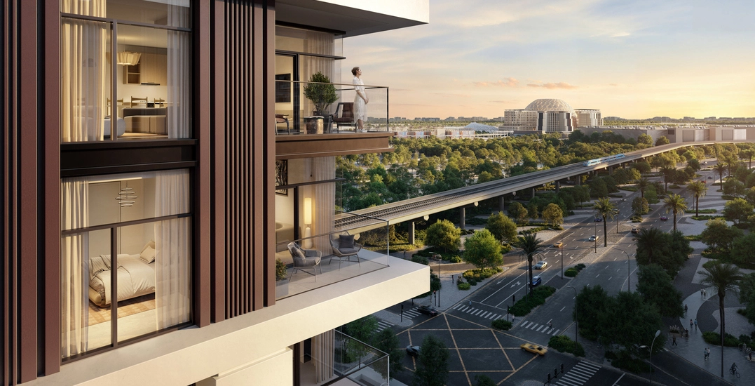 Residential tower balcony overlooking a vibrant city and transport network, symbolizing strategic location choices when building a real estate portfolio.