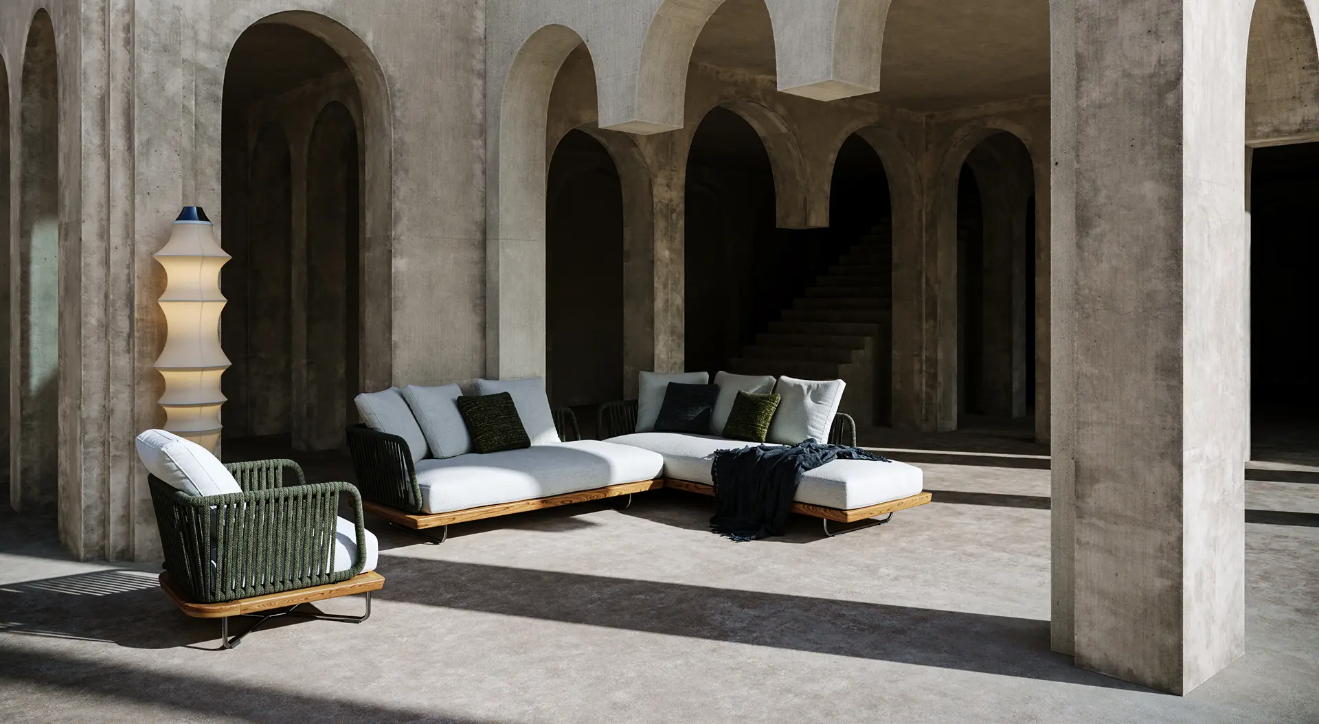 3D product rendering of a dining room setup featuring a glass table with modern wooden chairs, illuminated by a suspended minimalist pendant light and accent wall sconces. The dark blue walls add contrast and depth.