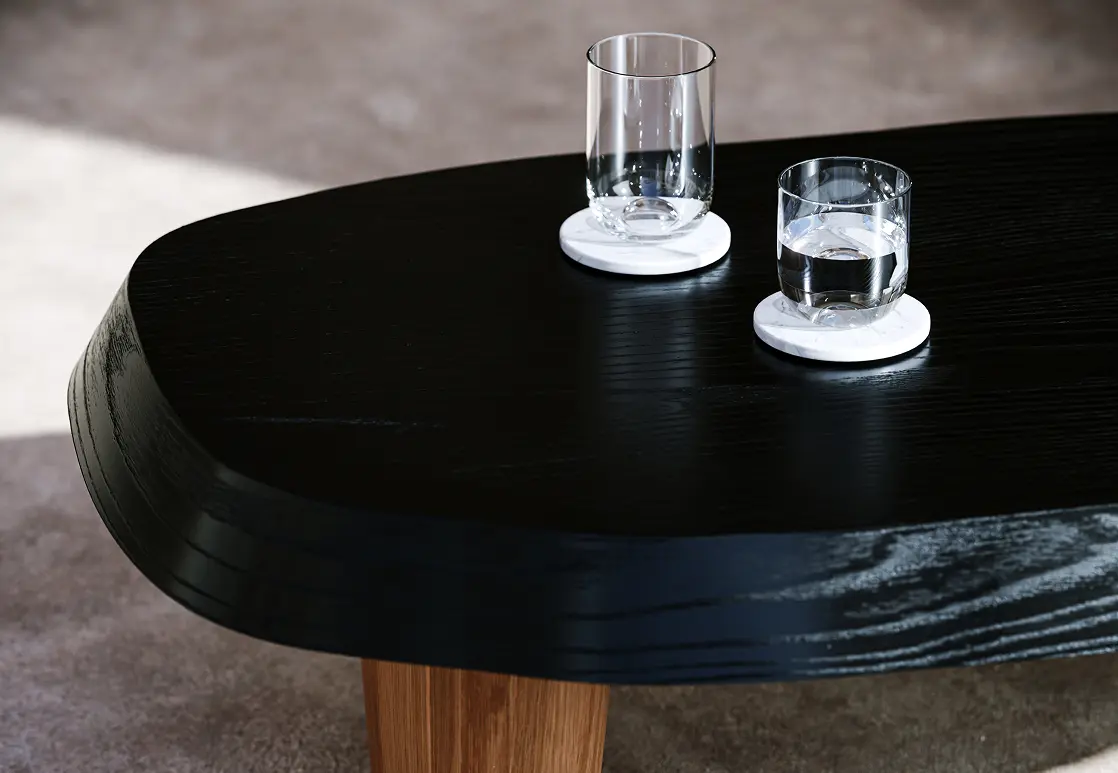 A sophisticated living room design featuring a gray sectional sofa, a wooden accent wall with sculptural art, and large glass windows, crafted as a stunning 3D product rendering.