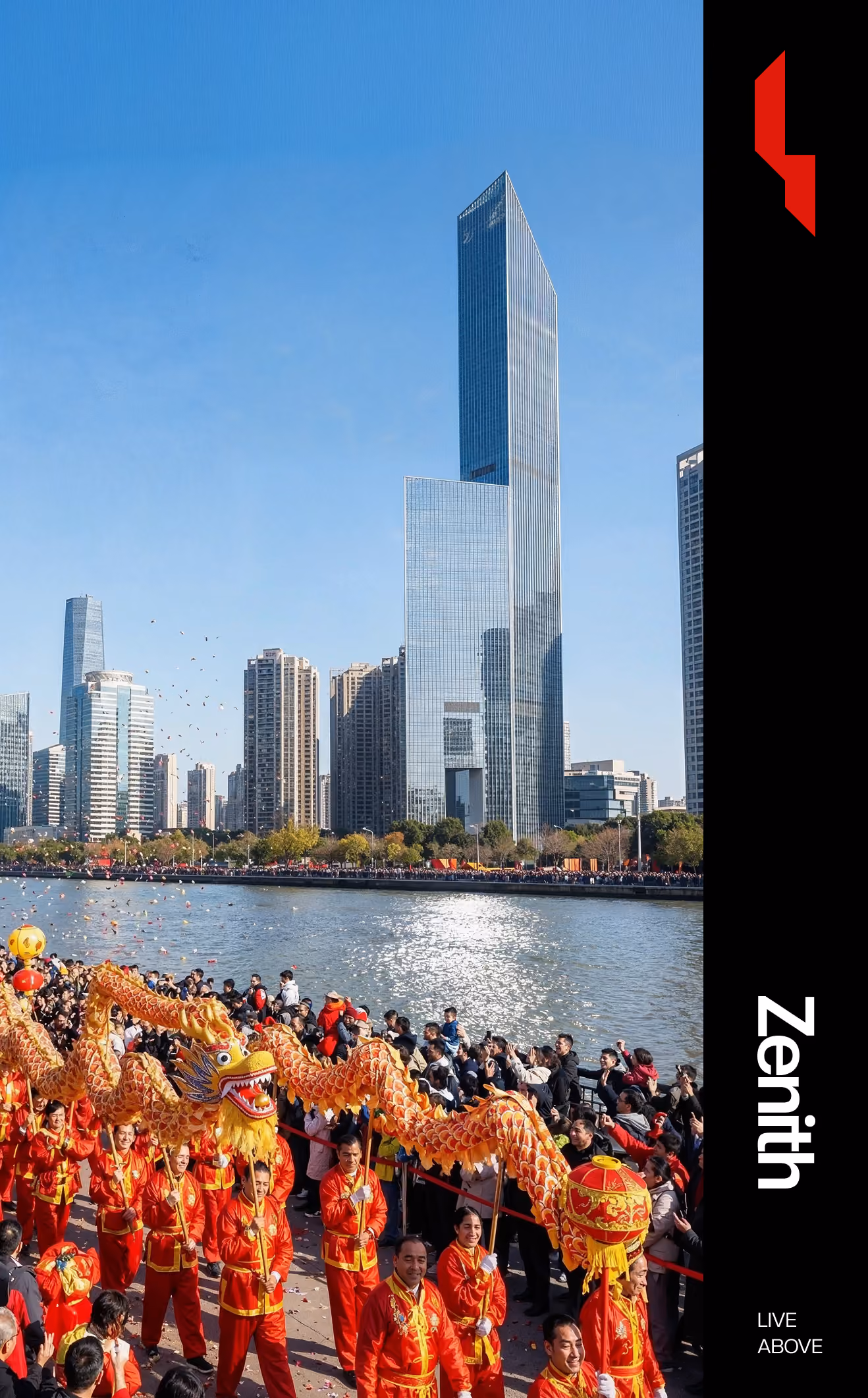 People in red costumes performing a dragon dance by a river with city skyscrapers in the background.