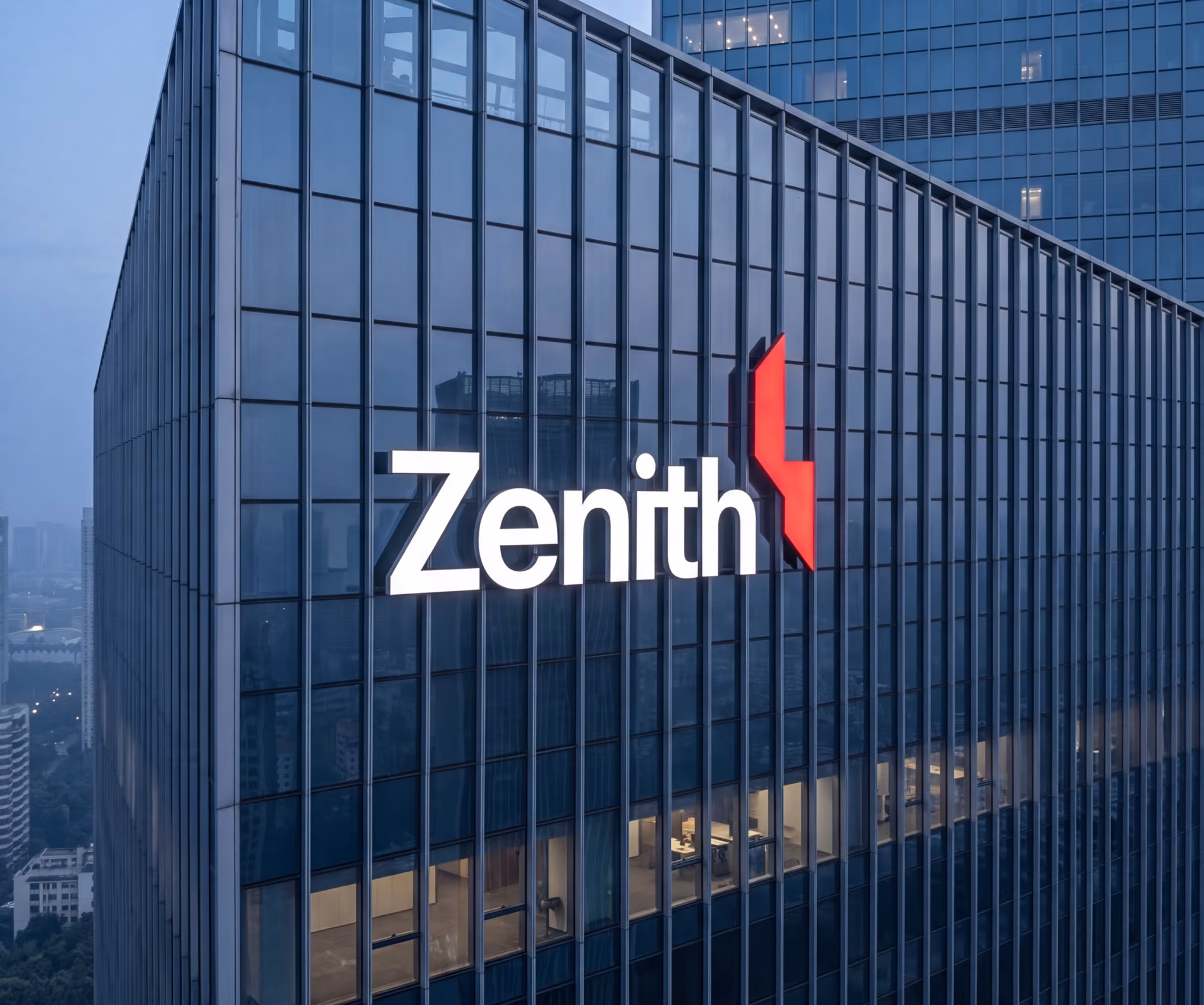 Modern glass office building with large illuminated Zenith logo and red abstract symbol on facade.