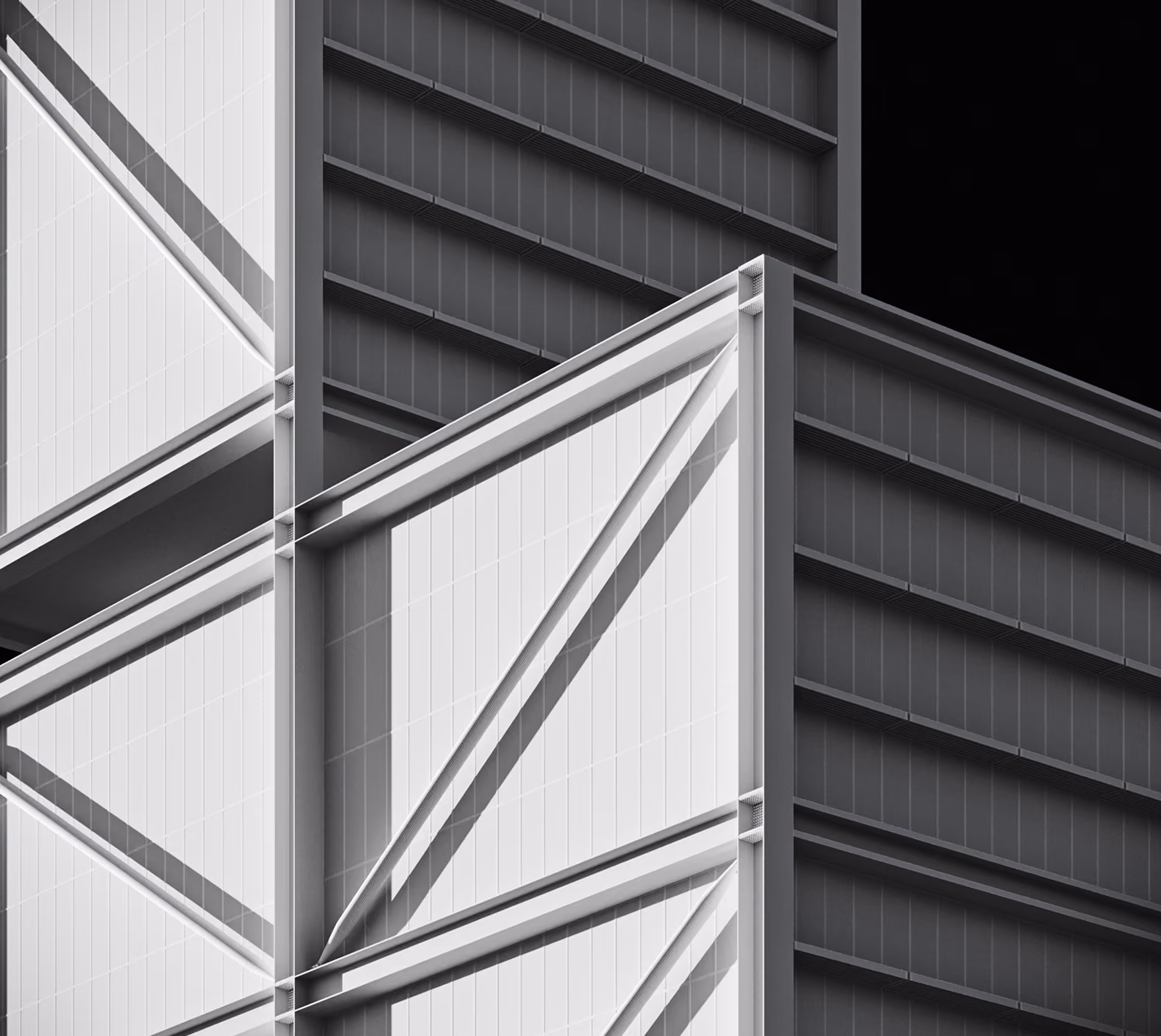 Close-up view of a modern building's geometric facade with white and dark panels and diagonal supports.