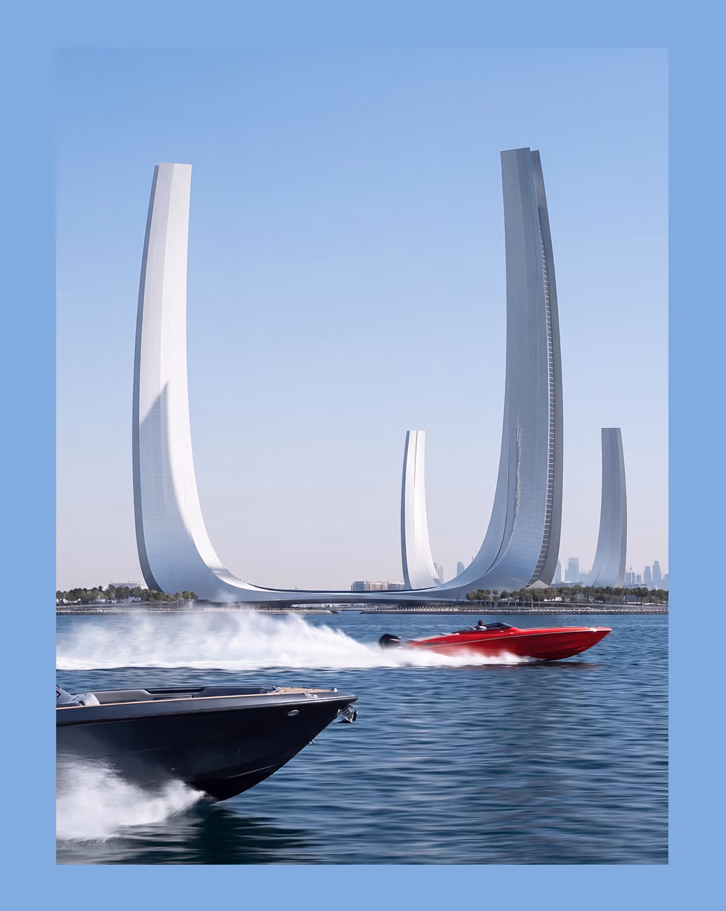 Two speedboats, one black and one red, racing on water in front of four tall, curved modern skyscrapers on a waterfront under a clear sky.