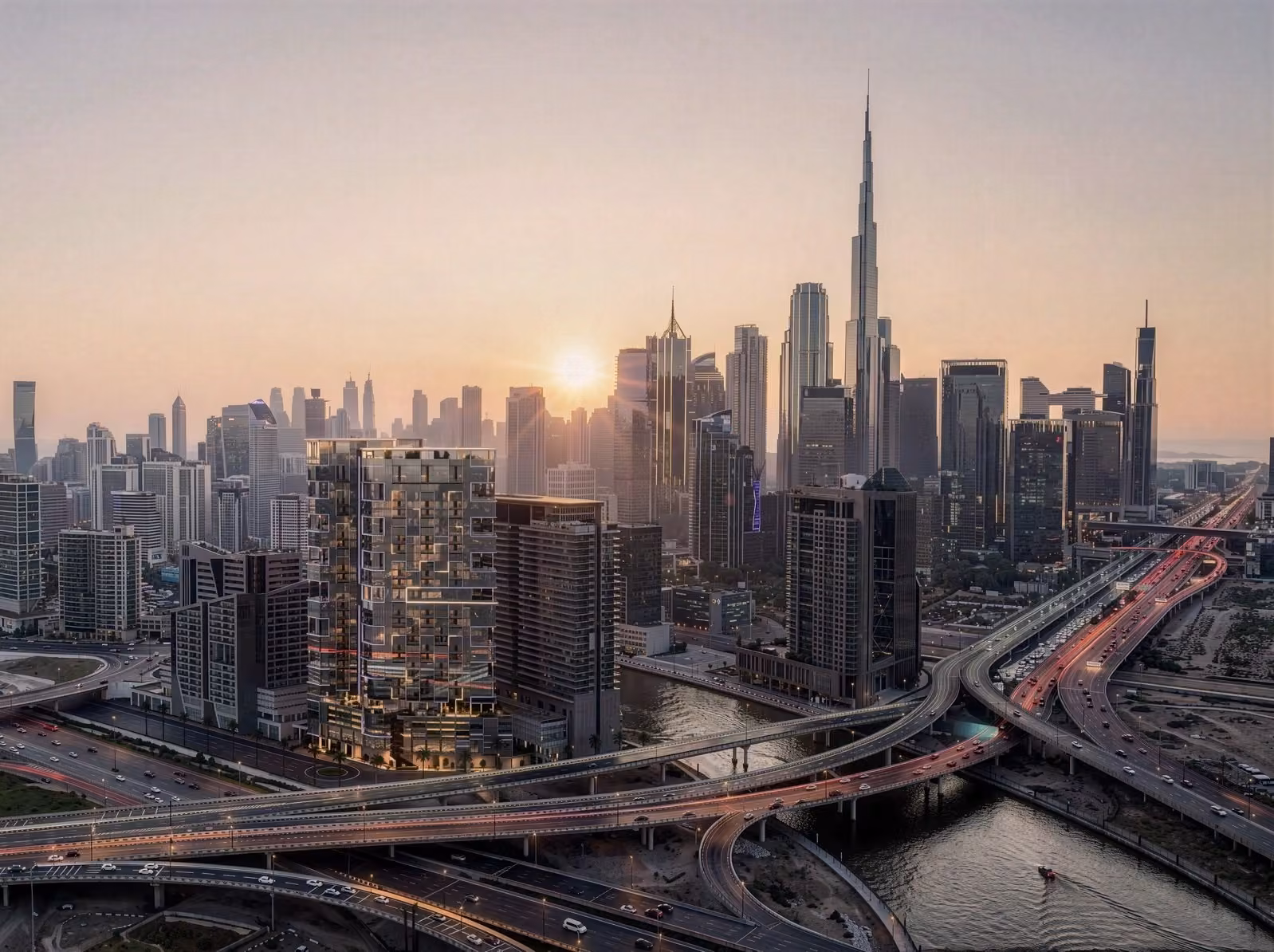 Evening aerial of modern business complex with illuminated glass buildings and active street life — produced with 3D exterior visualization services.