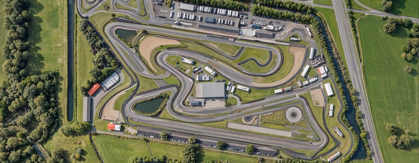 3D rendering in Adelaide of a top-down aerial view of a racetrack layout with detailed curves, facilities, and surrounding roads.