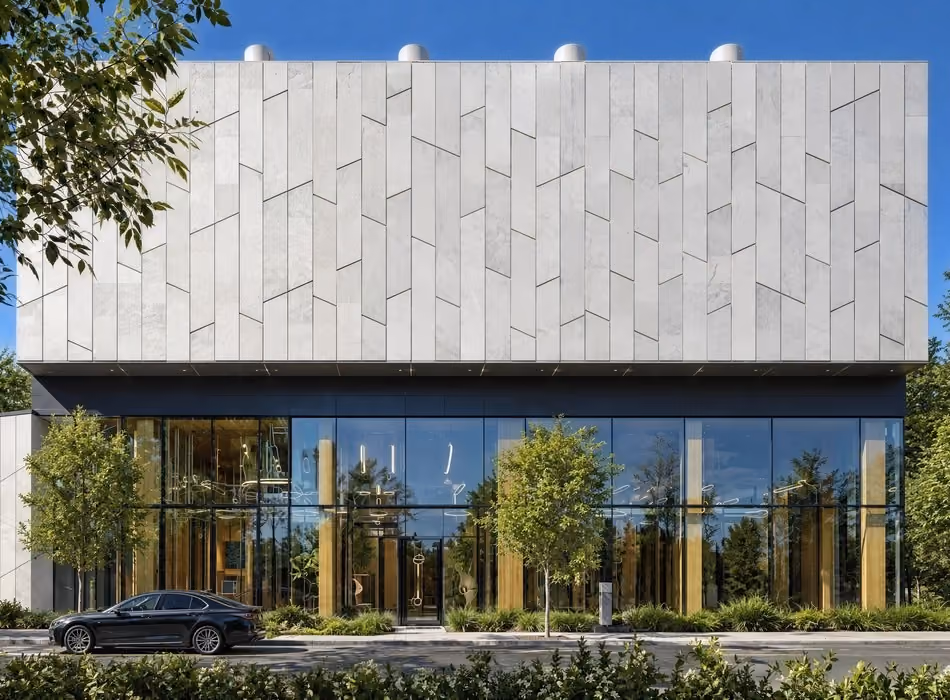 3d industrial rendering of a contemporary industrial utility building with metallic facade panels, full-height glass frontage, and clean urban streetscape landscaping.
