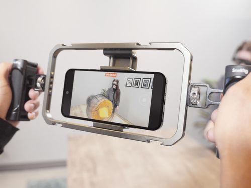 A mobile device being used to record a video of a user wearing a Magic Leap AR headset.