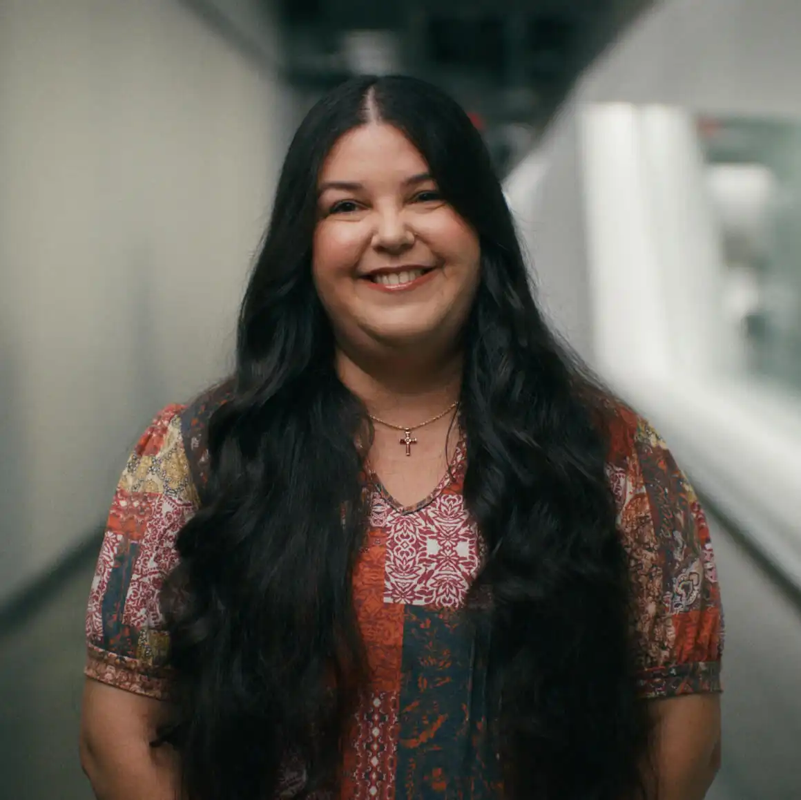 A smiling Magic Leap employee shares their passion for AR, driving spatial app and mixed reality innovation.