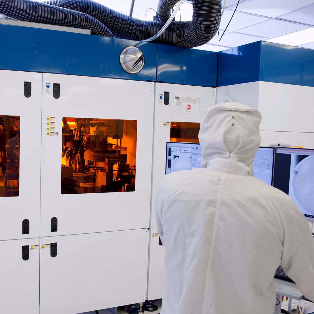 A Magic Leap engineer operating Magic Leap's proprietary Jet and Flash Imprint Lithography (JFIL) machine.