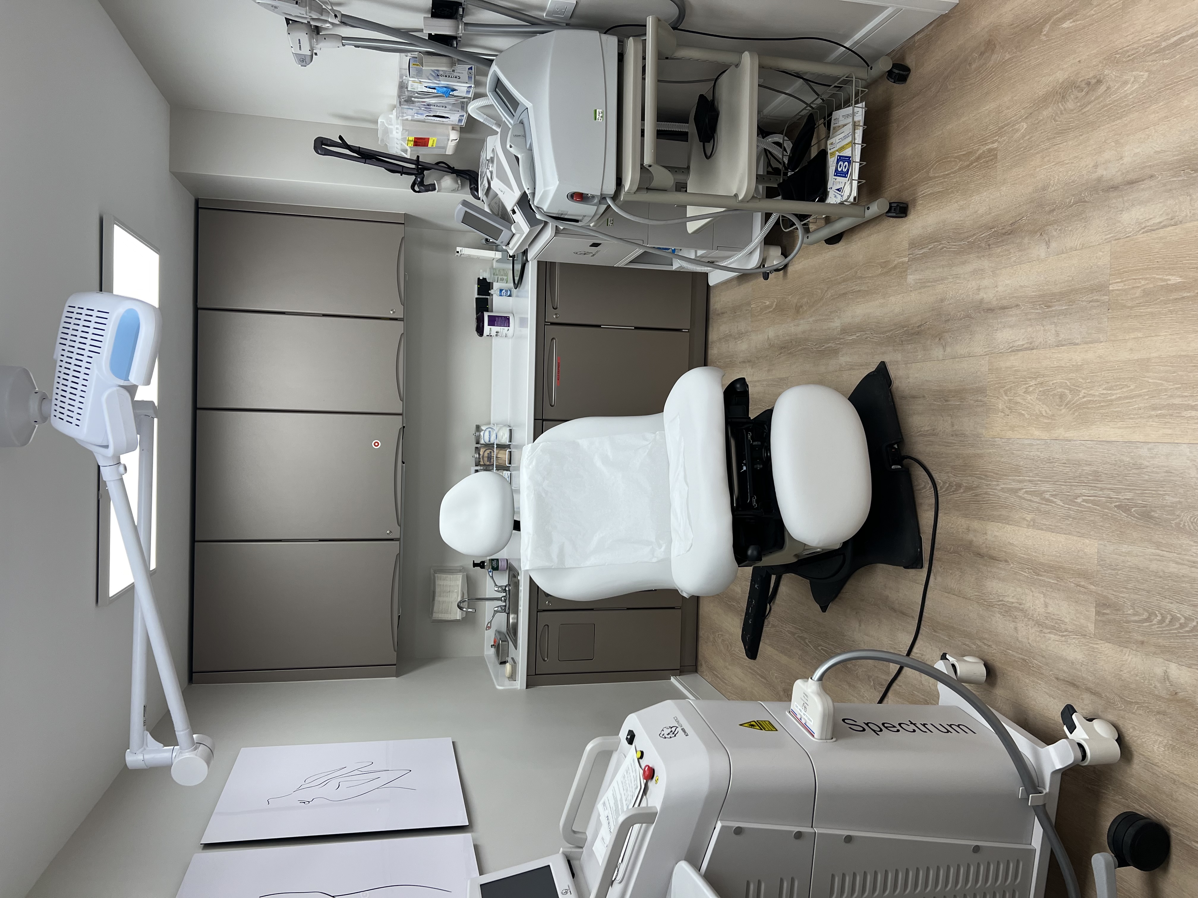 Treatment room with a procedure chair at the Perry Plastic Surgery Center
