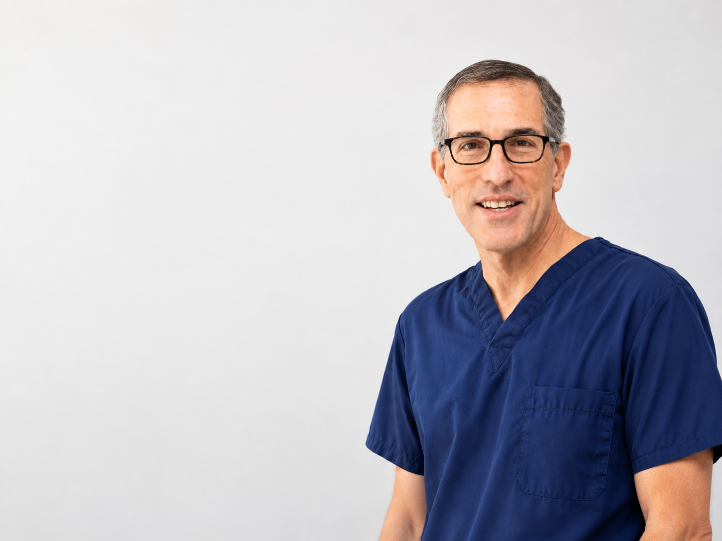 Arthur W. Perry, MD, FACS in navy surgical scrubs