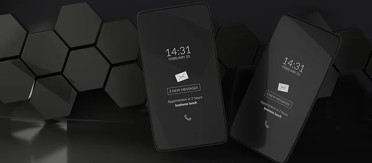 Black and white smartphones with lock screens showing time and messages