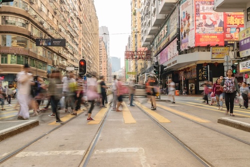 Fractional experts in Hong Kong walking between meetings