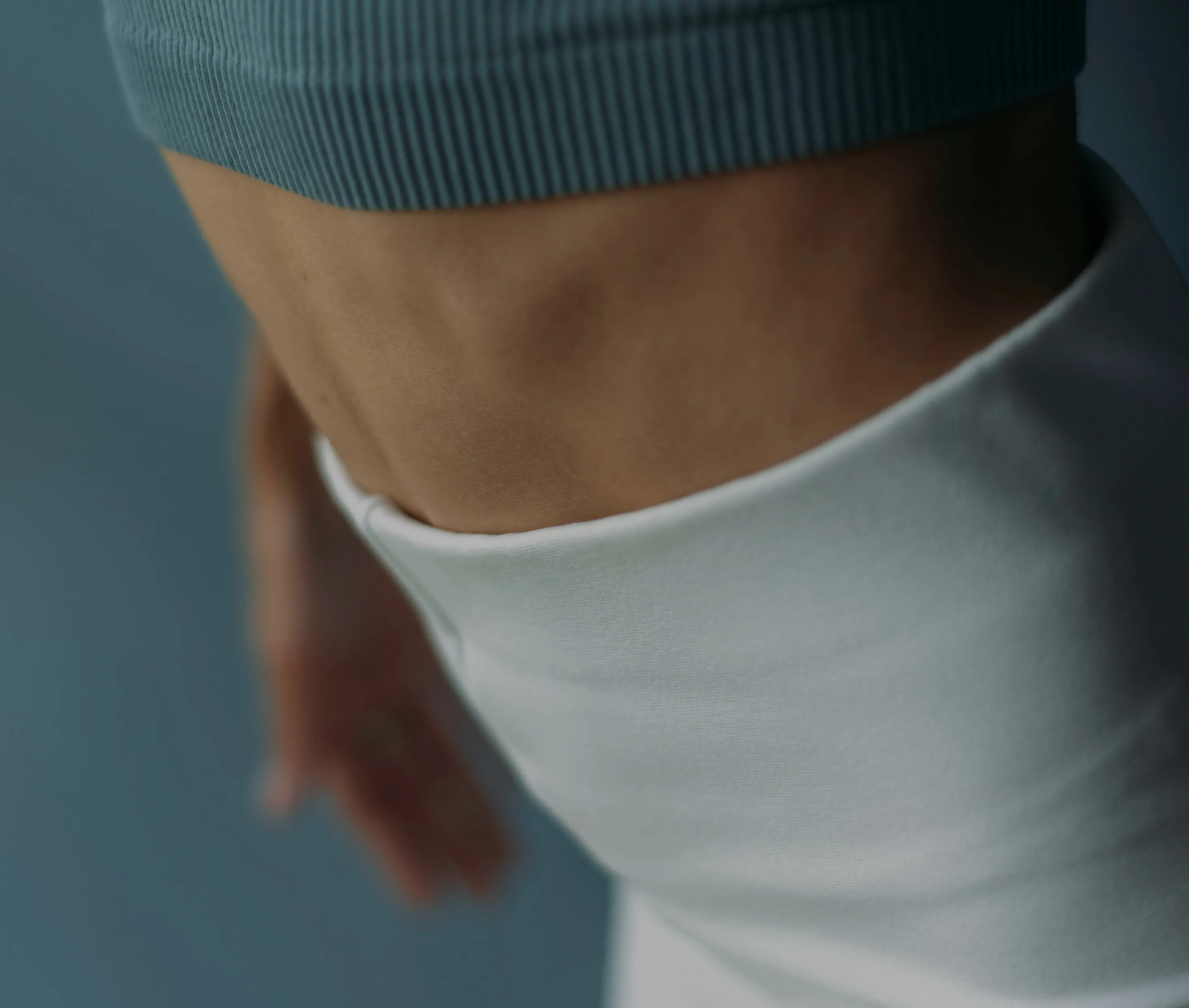 A close up of a person wearing a white shirt