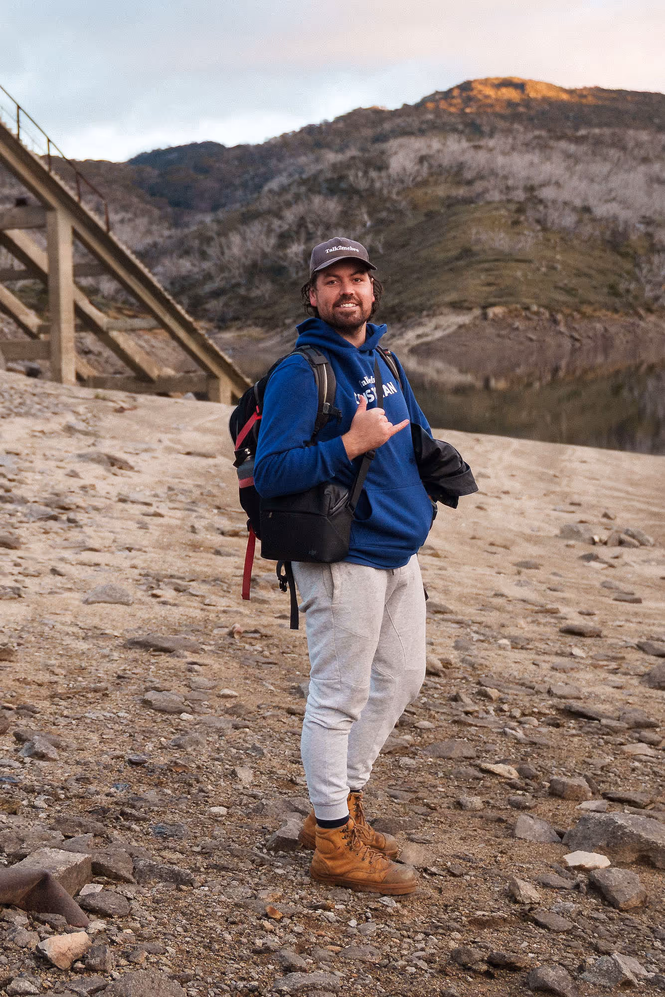 A man standing on a riverbank