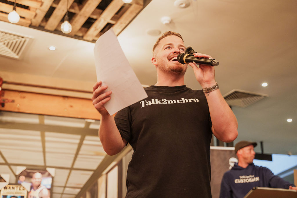 A man talking on a microphone