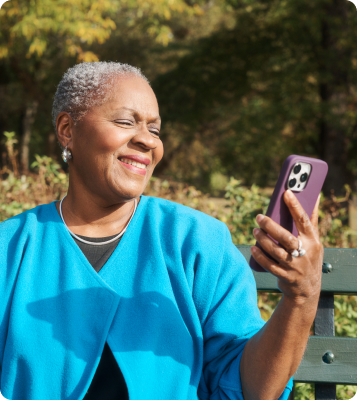 A woman on a bench facetiming