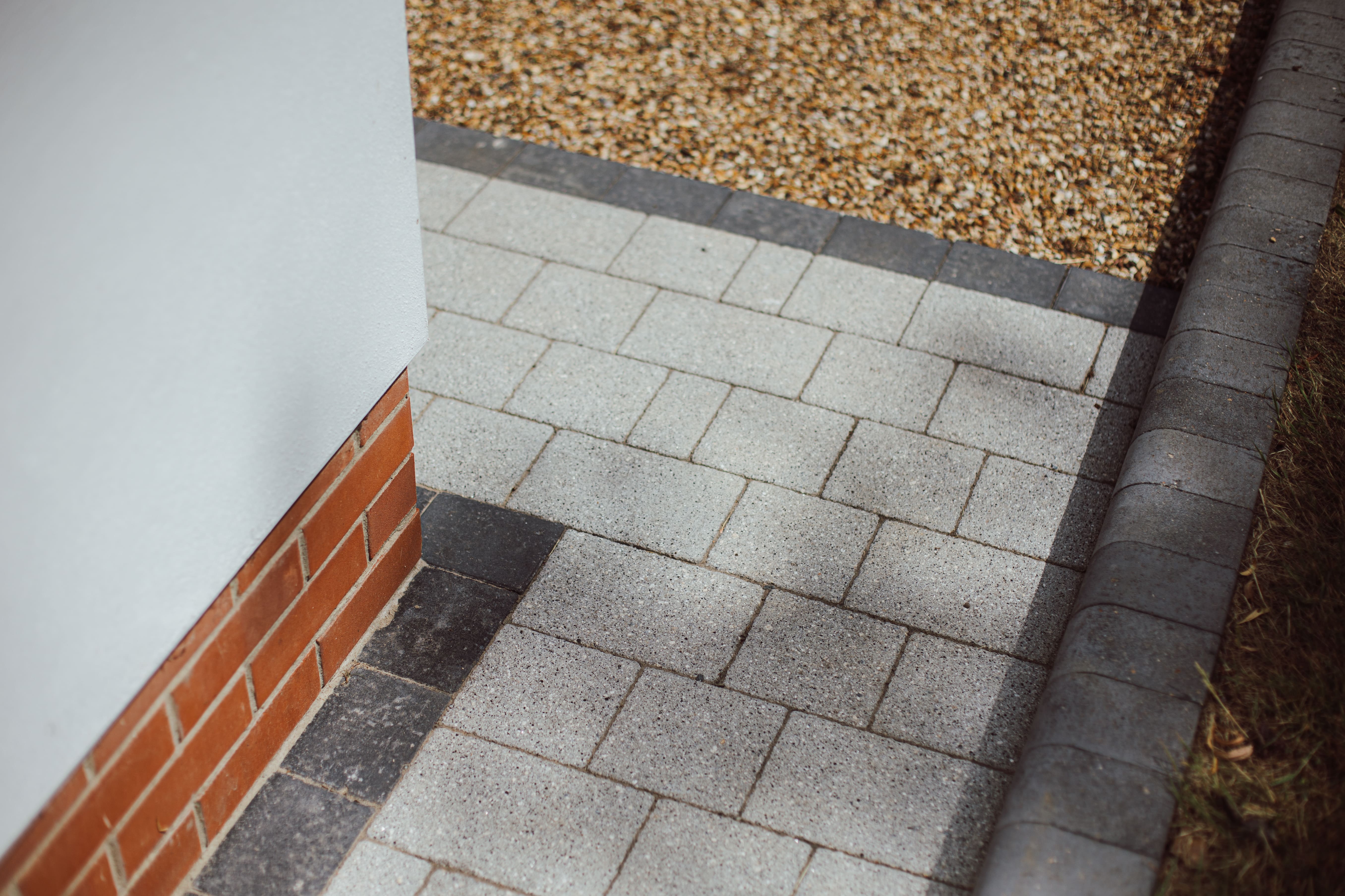 Close up view of the granite effect block paving and raised edges. 