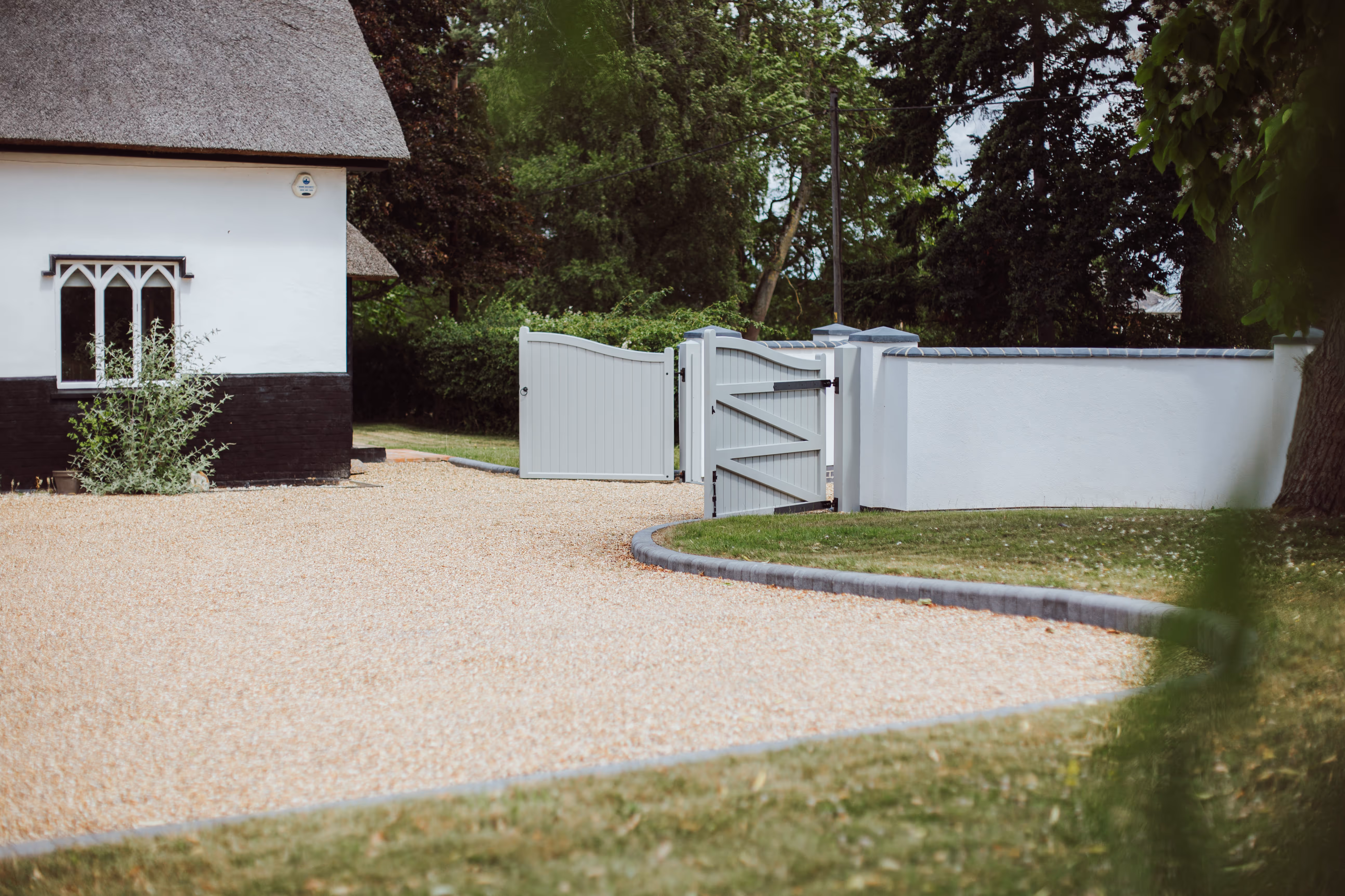 Gravel Driveway and Open wooden gates at Church Cottage.