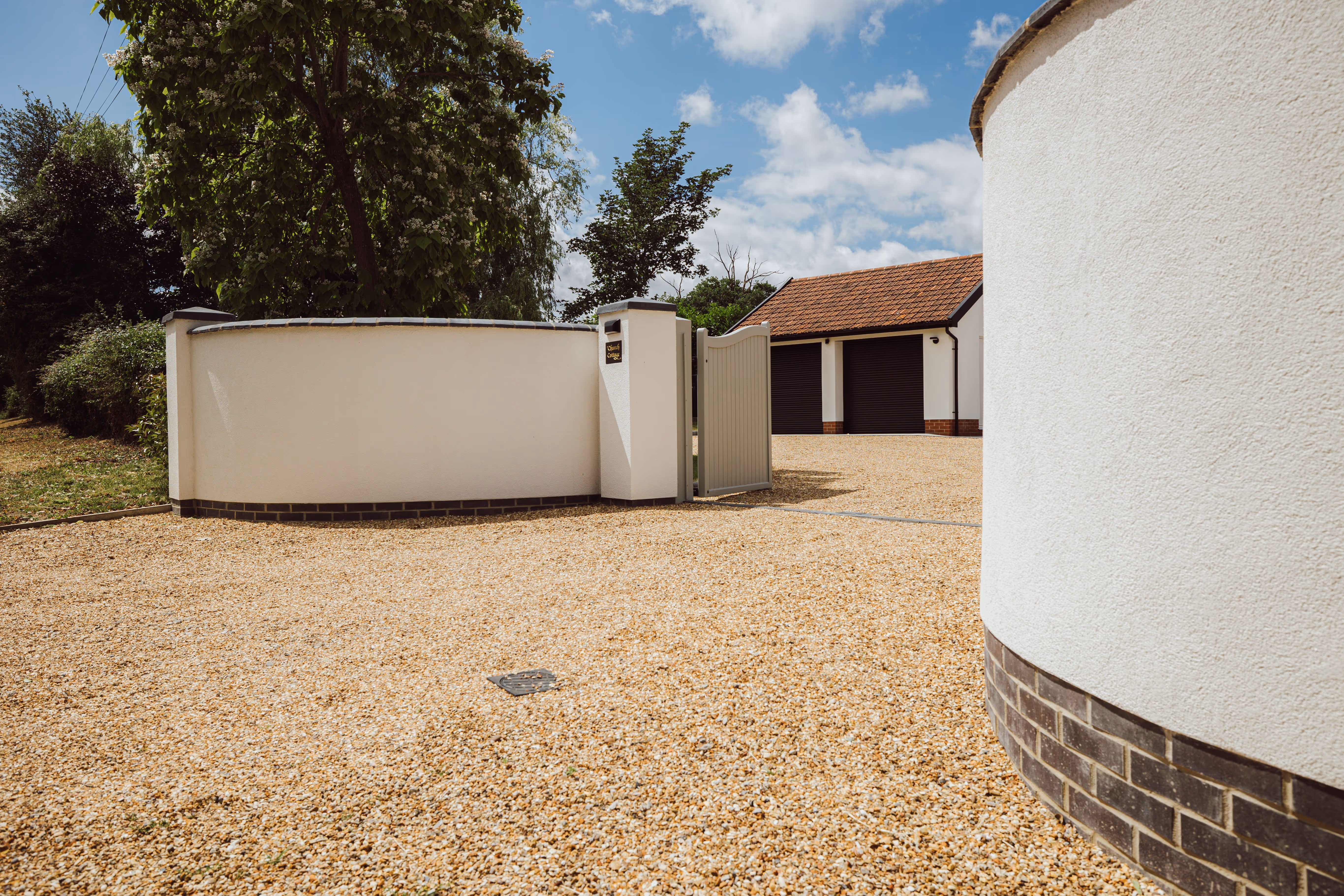 Front view of rendered White walls at Church Cottage