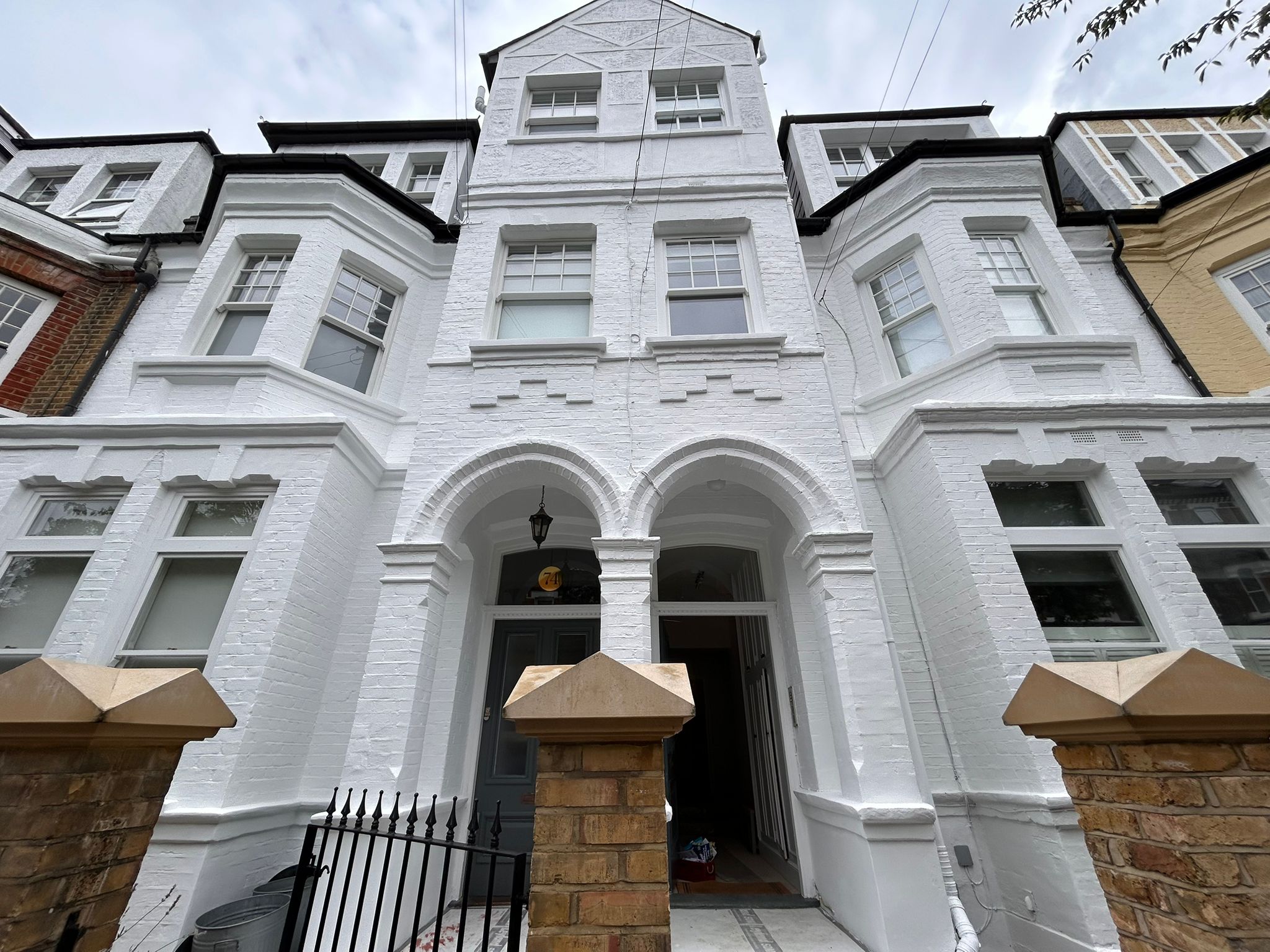 Facade, windows and front door repainted and restored.