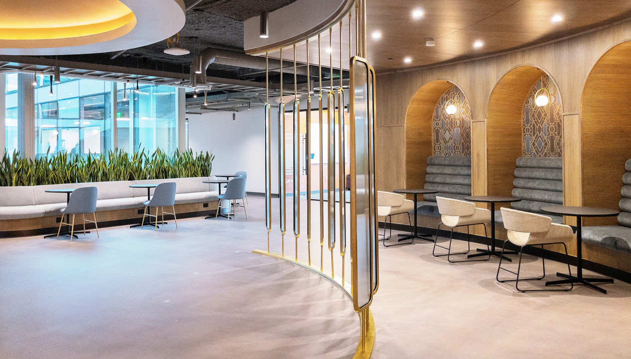 Consulting firm banquette seating with archways and greenery seating area
