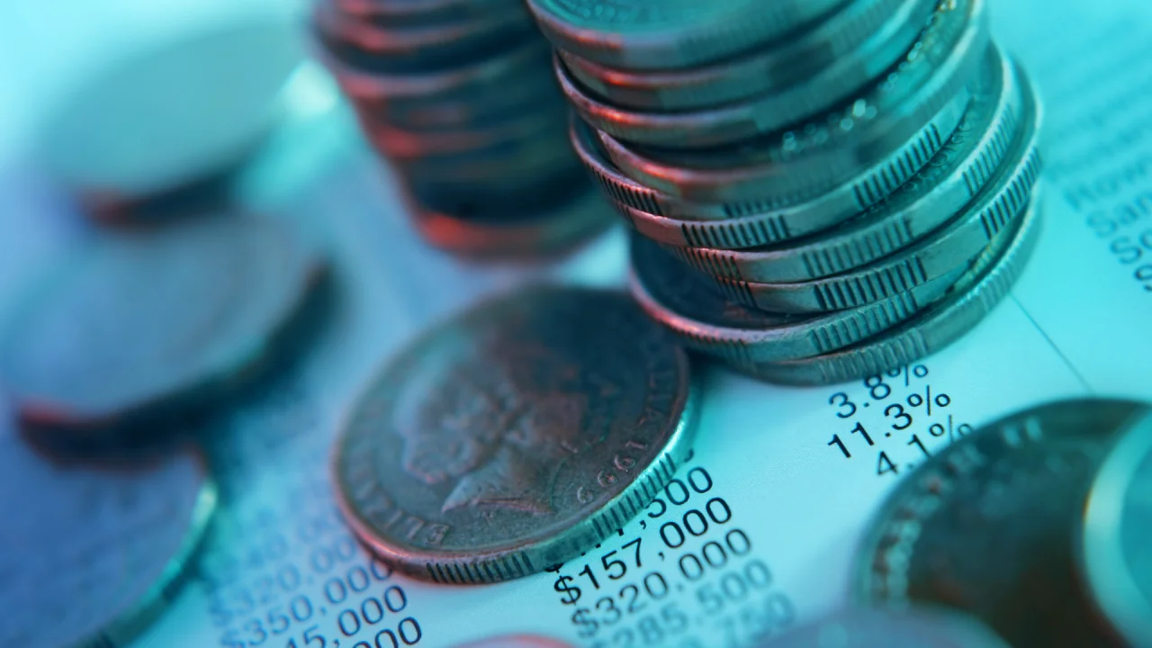 Coins on a blue & purple background