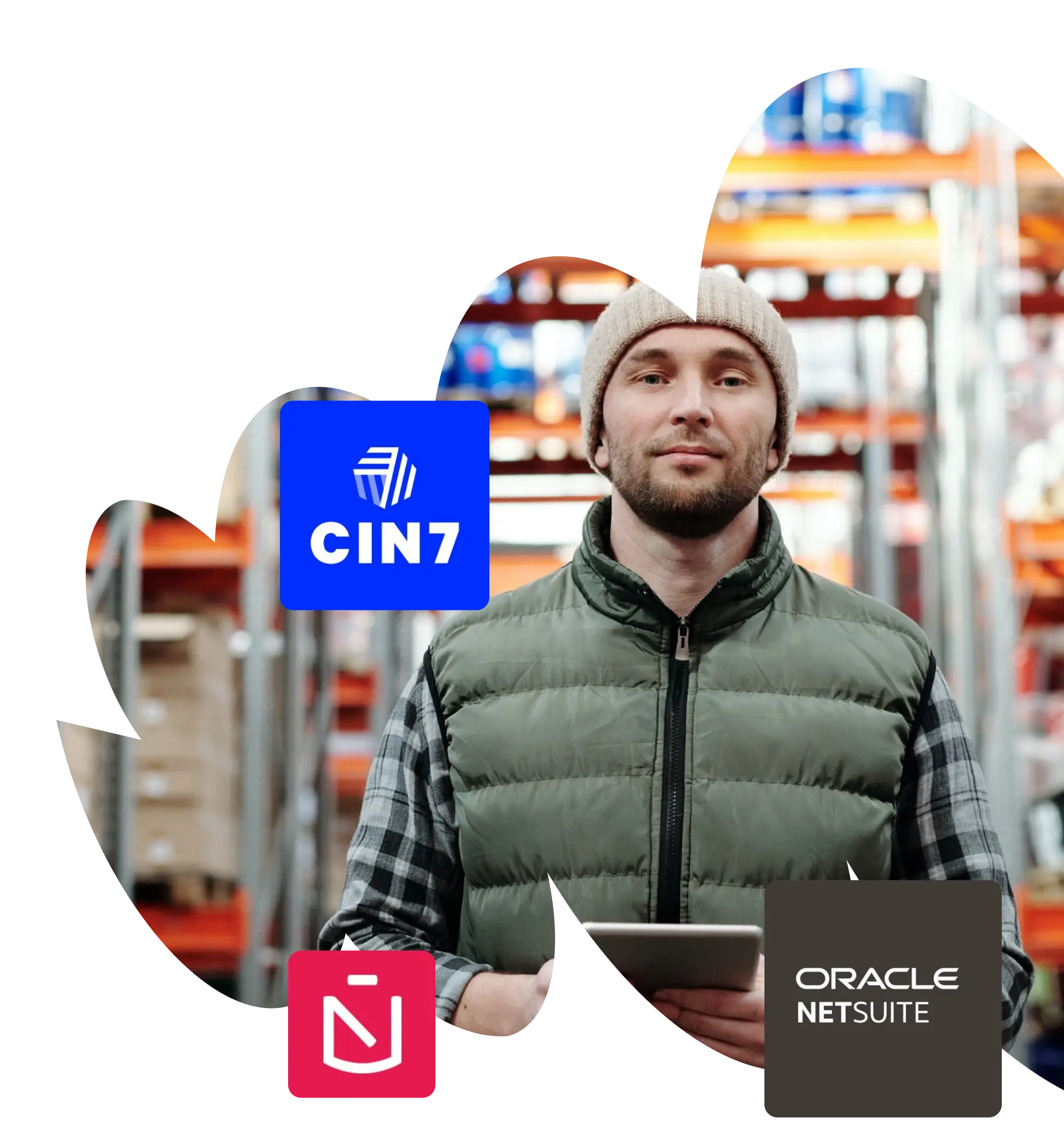 A man holding a tablet in a warehouse.