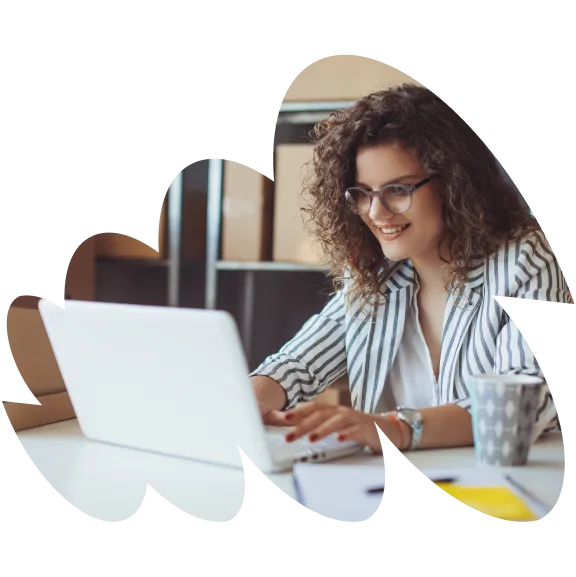 Woman smiling while typing on computer
