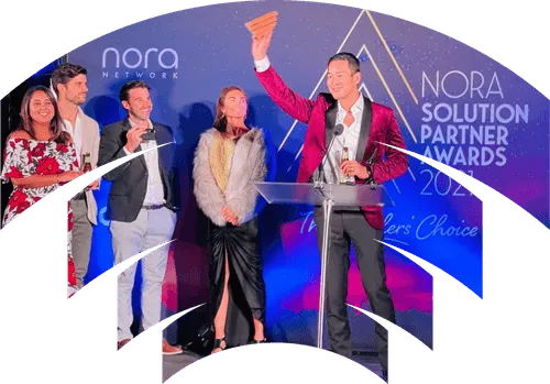 Man accepting an award at the Nora solution partner awards